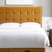 The Simba Hoxton bed in mustard velvet features a bold padded headboard and contemporary design finish