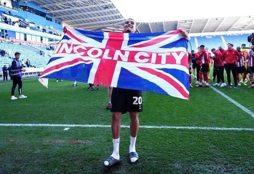 Lincoln City's Ryan One celebrates promotion with Lincoln City. Cr: PA.