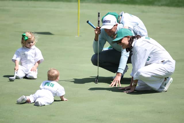 Jordan Spieth pictured in the Par 3 Contest on Wednesday with wife Annie and their children