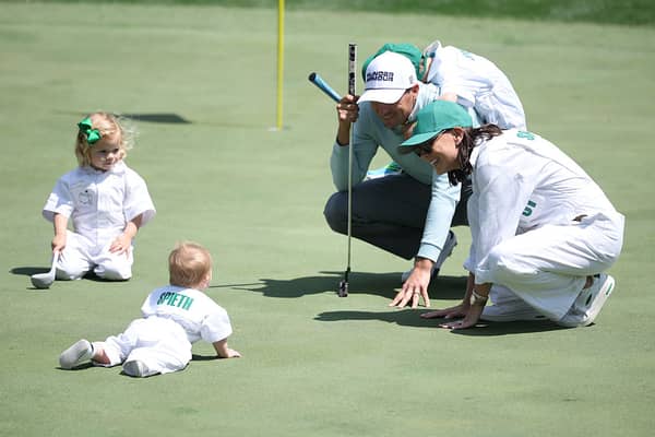 Jordan Spieth of the United States, wife Annie, son Sammy, daughter Sophie and son Sully on the ninth green.