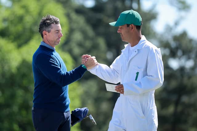Rory McIlroy and his caddie Harry Diamond shake hands at the end of the first round of the 2026 Masters Tournament at Augusta National Golf Club