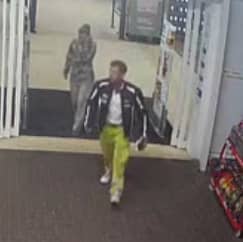 Lee Milne walking ahead of Kimberly Milne while leaving supermarket at Kingsway, Dundee on 27 July 2023