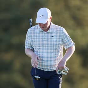 A dejected Bob MacIntyre pictured on the 18th green during the first round of the 2026 Masters Tournament at Augusta National Golf Club 