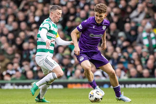 St Mirren's Jacob Devaney (R) and Celtic's Callum McGregor battle for the ball at Parkhead on Saturday.