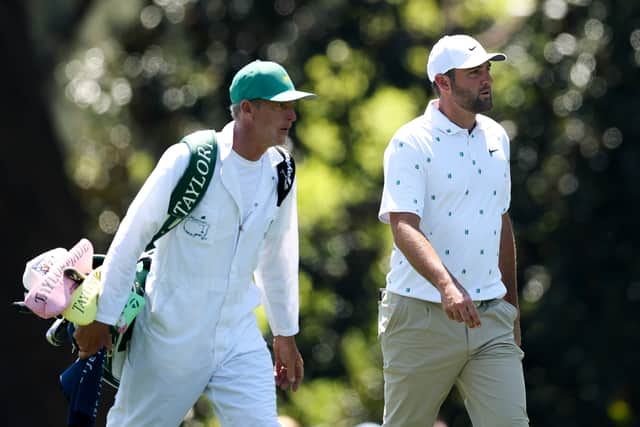  Scottie Scheffler and his caddie Ted Scott walk on the eighth fairway during the third round of the 2026 Masters Tournament at Augusta National Golf Club 