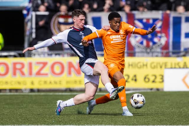 Falkirk's Ben Broggio tussles for possession with Rangers winger Djeidi Gassama