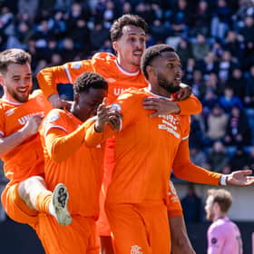 Rangers striker Youssef Chermiti (R) celebrates his second goal of the game against Falkirk with team-mates
