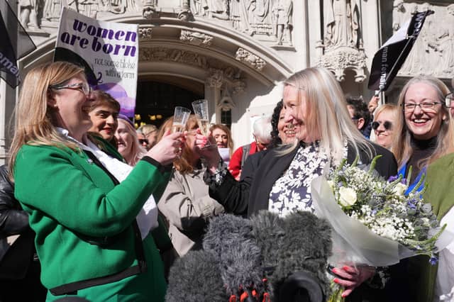 Susan Smith, left, and Marion Calder, right, co-directors of For Women Scotland, celebrate with campaigners outside the Supreme Court in London after it ruled the terms 'woman' and 'sex' in the Equality Act refer to a biological woman and biological sex