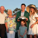 Rory McIlroy celebrates becoming just the fourth player to win the Masters back-to-back with dad Gerry, mum Rosie, daughter Poppy and wife Erica 