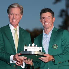 Having already given him his second Green Jacket, Augusta National chairman Fred Ridley presents the Masters Tournament trophy to Rory McIlroy