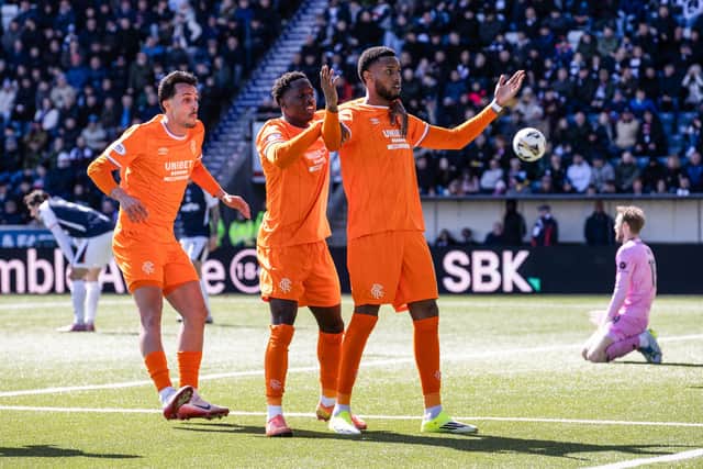 Rangers striker Youssef Chermiti (R) is congratulated by Djeidi Gassama and Bojan Miovski after scoring against Falkirk