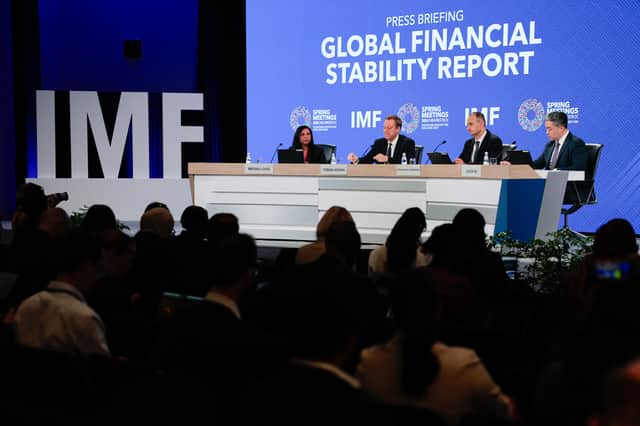 From left, Meera Louis, communications officer at IMF,  Tobias Adrian, director of monetary and capital markets at IMF, Athanasios Vamvakidis, deputy director of monetary and capital markets at IMF, and Jason Wu, assistant director of monetary and capital markets at IMF, participate in a press briefing about the IMF's Global Financial Stability Report in Washington DC