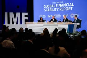 From left, Meera Louis, communications officer at IMF,  Tobias Adrian, director of monetary and capital markets at IMF, Athanasios Vamvakidis, deputy director of monetary and capital markets at IMF, and Jason Wu, assistant director of monetary and capital markets at IMF, participate in a press briefing about the IMF's Global Financial Stability Report in Washington DC