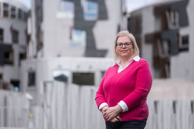 Anne Anderson in front of the Scottish Parliament