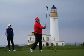 US President Donald Trump plays golf at his Turnberry resort last year
