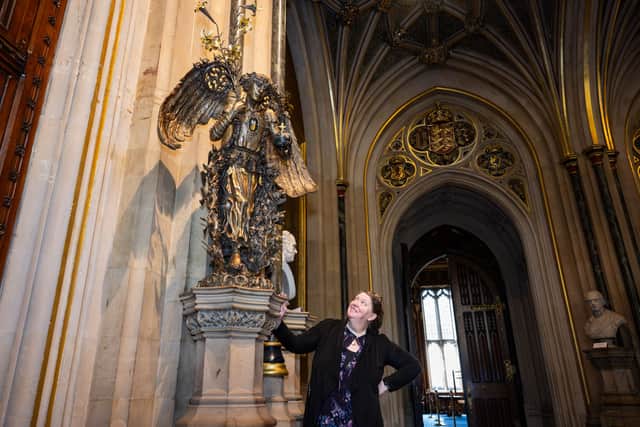 Artist Eleanor Crooks with her bronze angel sculpture of Queen Elizabeth II. PIC: House of Lords.