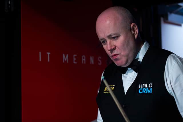 John Higgins will finish his first round match today.