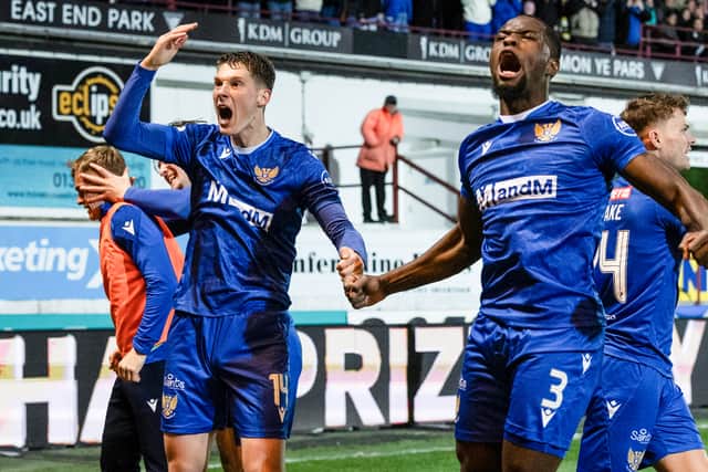 St Johnstone's Matty Foulds, left, and Chieck Diabate in front of the large travelling support against Dunfermline.