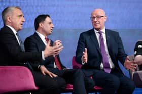Alex Cole-Hamilton, leader of the Scottish Liberal Democrats, Scottish Labour leader Anas Sarwar and SNP leader and First Minister John Swinney debate during a hustings event in the run-up to the Holyrood election
