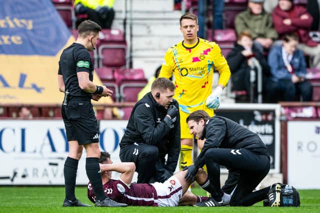 Hearts' Oisin McEntee goes down injured during the Premiership win over Motherwell at Tynecastle Park, on April 11, 2026. (Photo by Paul Devlin / SNS Group)
