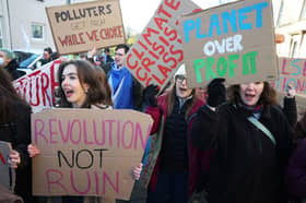 Demonstrators attend a protest in Glasgow on the Global Day Of Climate Action in November 2025. 