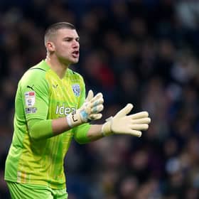 Celtic have signed goalkeeper Sam Johnstone from Wolves.