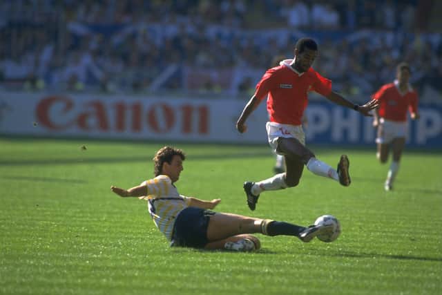 Dave McPherson (left) of Scotland tackles J Cayass (right) of Costa Rica during the 1990 World Cup match at the Luigi Fenara Stadium in Genoa, Italy. Costa Rica won the game 1-0.