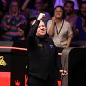 John Higgins celebrates winning his match against Ronnie O'Sullivan on day ten of the Halo World Snooker Championship 2026 at the Crucible Theatre, Sheffield. 