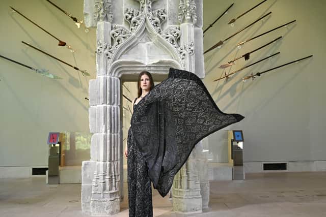 The fashion show uses the galleries of the museum.