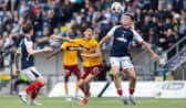 Falkirk's Lewis Neilson (R) and Motherwell's Elijah Just in action