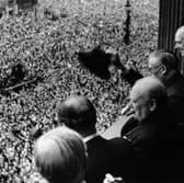 Winston Churchill waves to crowds gathered in Whitehall, London, on VE Day, May 8, 1945. (Picture: Keystone/Hulton Archive)