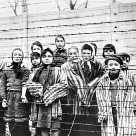 Child survivors pictured at Auschwitz-Birkenau, a Nazi complex that included a killing centre, a labour camp and a concentration camp, in 1945 (Picture: Alexander Vorontsov/Galerie Bilderwelt)