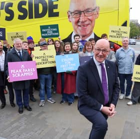 First Minister John Swinney out campaigning with SNP activists.