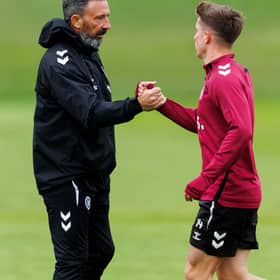 Derek McInnes, left, welcomes Hearts midfielder Cammy Devlin at training.