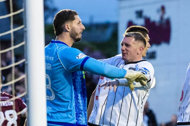 Dunfermline keeper Aston Oxborough made a late penalty save against Arbroath.