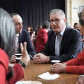Prime Minister Sir Keir Starmer and James Murray, Chief Secretary to the Treasury, left, meet Labour Party members at Kingsdown Methodist Church Hall in Ealing, west London, on Friday