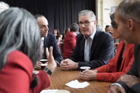 Prime Minister Sir Keir Starmer and James Murray, Chief Secretary to the Treasury, left, meet Labour Party members at Kingsdown Methodist Church Hall in Ealing, west London, on Friday