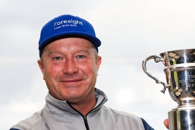 Greig Hutcheon shows off the trophy after winning the Senior PGA Professional Championship at Royal Dornoch