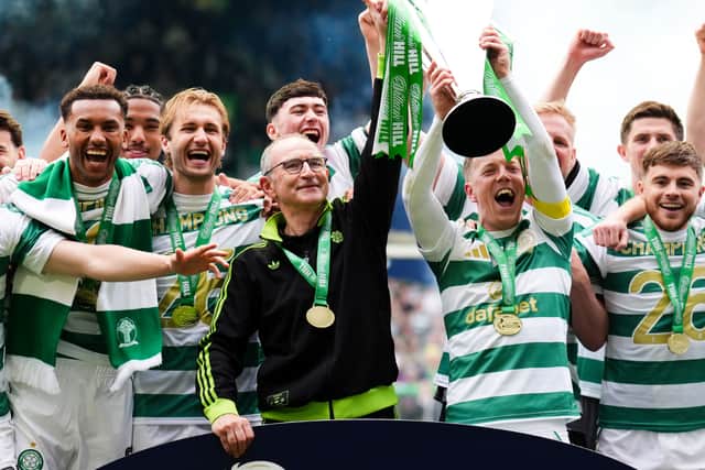 Celtic manager Martin O’Neill lifts the Scottish Premiership title alongside Callum McGregor
