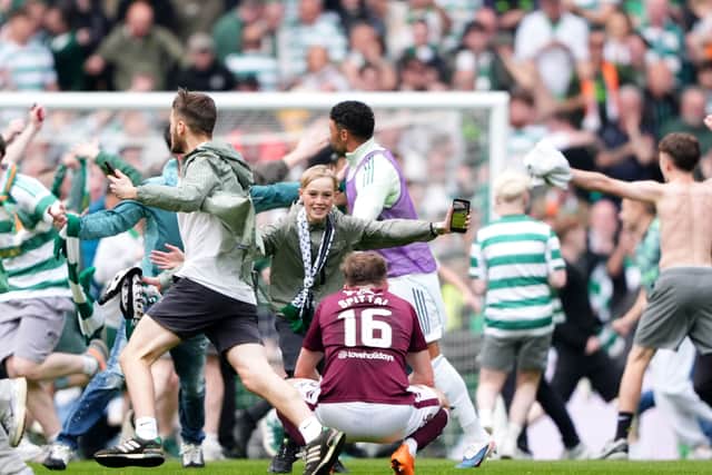 Celtic fans celebrate their sides victory over Hearts