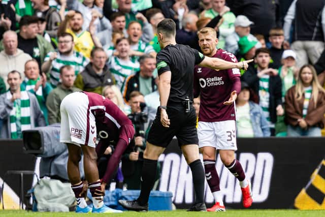 Alexandros Kyziridis sees a penalty awarded against him for handball in the 3-1 defeat to Celtic.