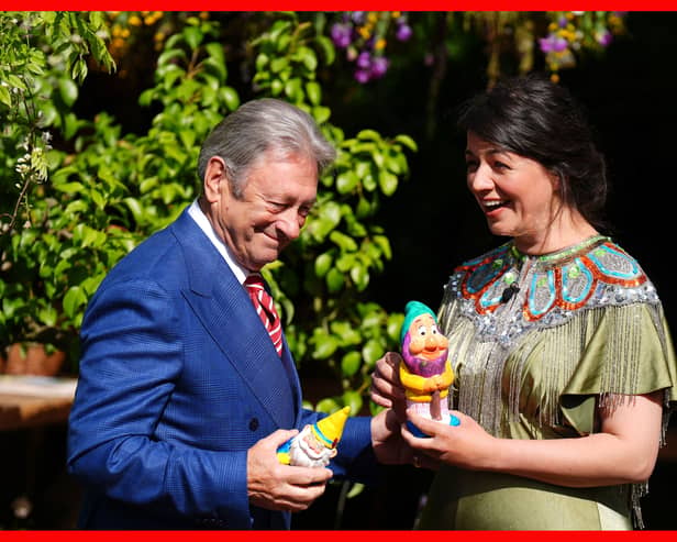 Gardener Alan Titchmarsh and horticulturalist Frances Tophill hold gnomes they have painted to raise money for the RHS Campaign for School Gardening (Picture: Aaron Chown)
