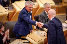 The Scottish Parliament's newly elected Presiding Officer, Kenny Gibson, is congratulated by John Swinney (Picture: Jeff J Mitchell)