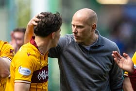 Jens Berthel Askou celebrates Conference League qualification with Motherwell midfielder Tom Sparrow. Cr: SNS Group.