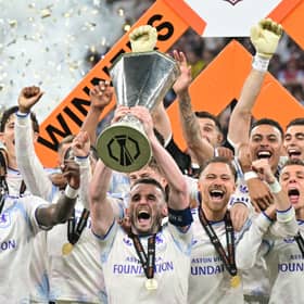 John McGinn lifts the Europa League trophy after captaining Aston Villa to a 3-0 win over Freiburg in the final at Besiktas Park in Istanbul.