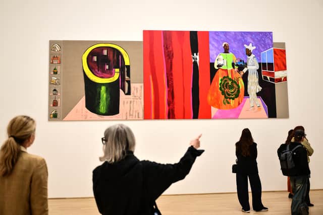 Visitors view Architects by artist Lubaina Himid in the British Pavilion during the pre-opening of the 61st Venice Biennale