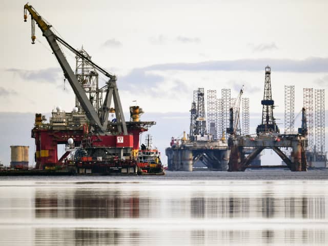 Disused North Sea oil rigs stacked up in the Cromarty Firth during a downturn in the sector in 2018