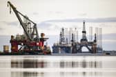 Disused North Sea oil rigs stacked up in the Cromarty Firth during a downturn in the sector in 2018