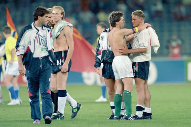 West Germany captain Lothar Matthaus consoles England player Paul Gascoigne.