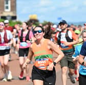 Edinburgh marathon runners make their way through Portobello